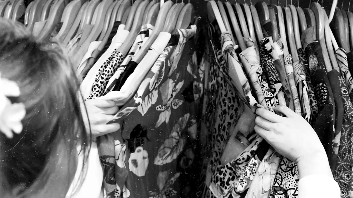 Buyers going through a rail of stock in the showroom.