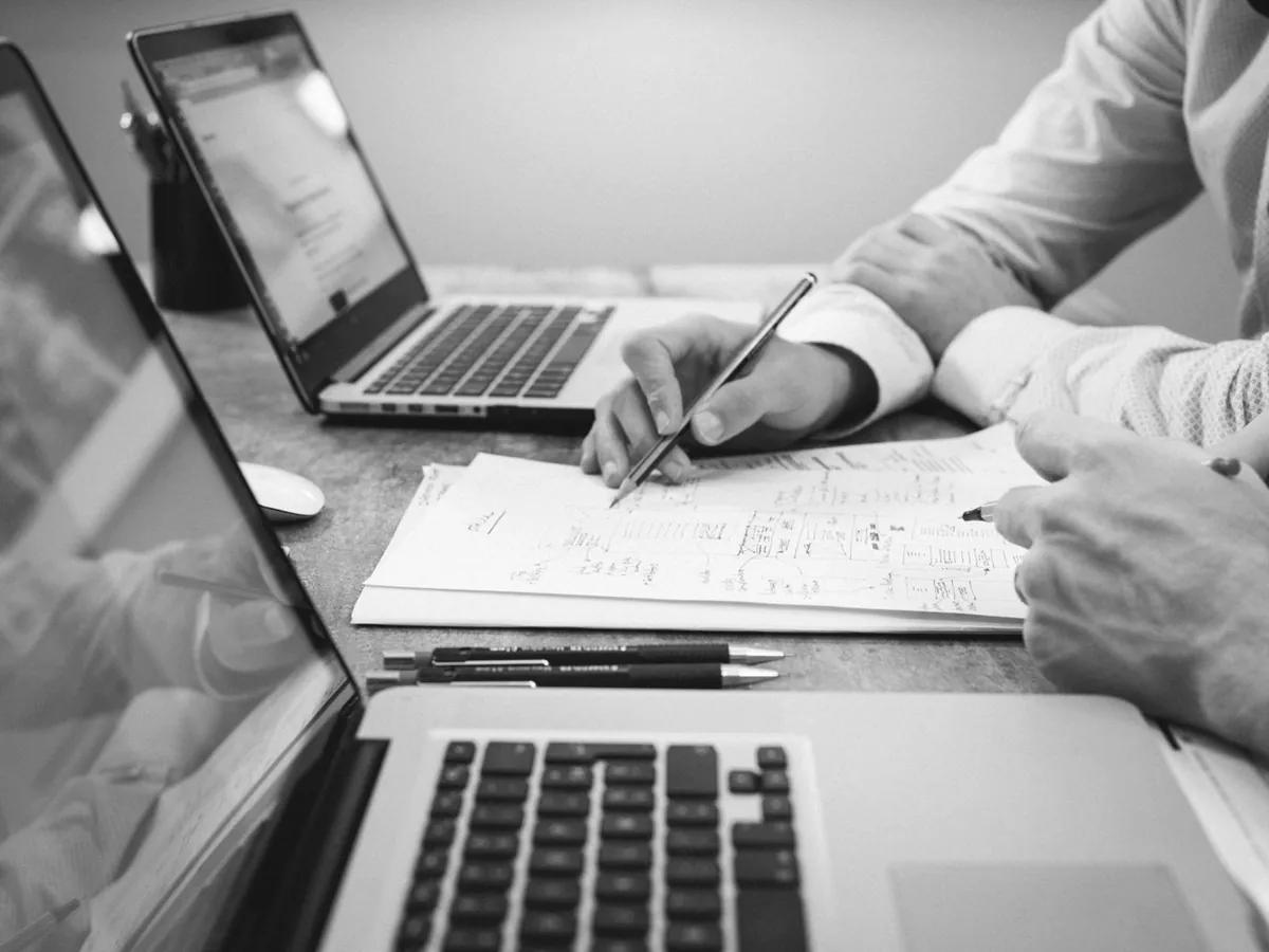 A buyer working through the catalogue on a laptop.