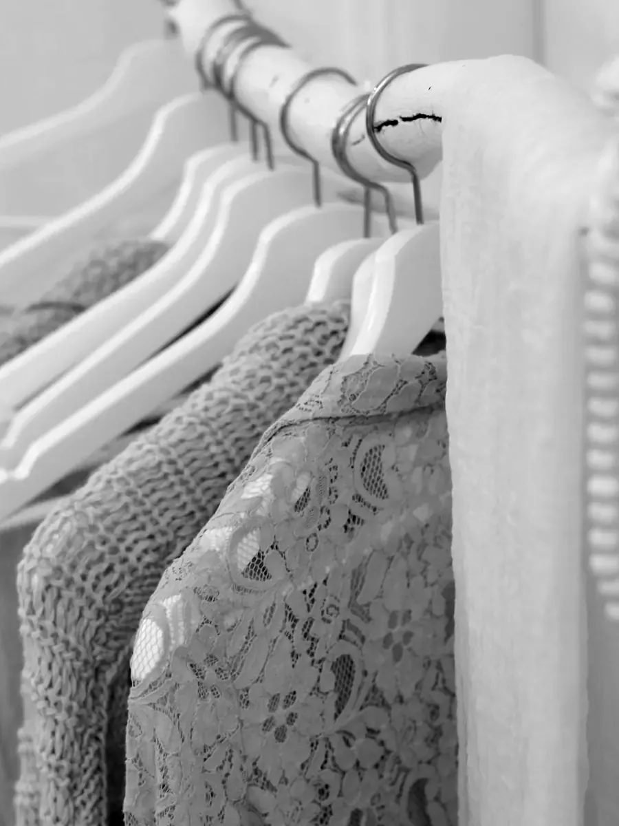 Knitwear hanging on a rail.