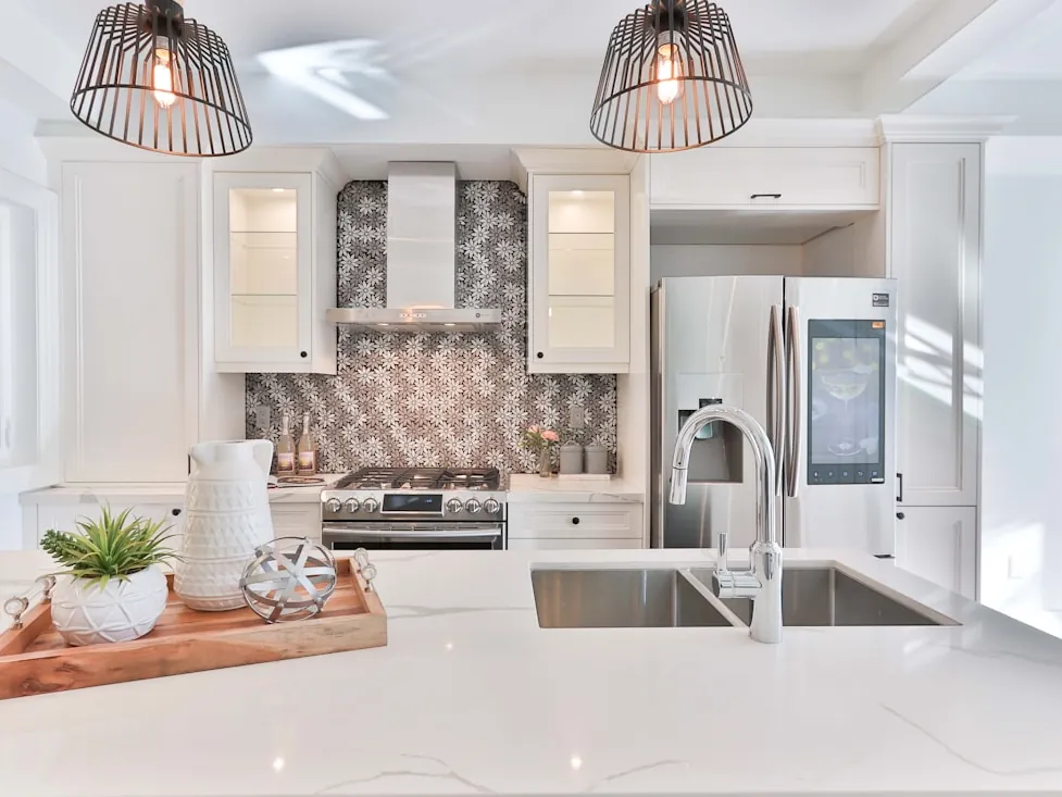A kitchen with a sink and mixer tap.